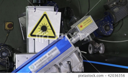 Laser Marking Machine Engraving. Manufacture of plastic water pipes factory. Process of making 42036356