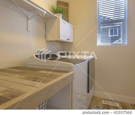 Clean laundary room in model home in Utah Valley 42037568