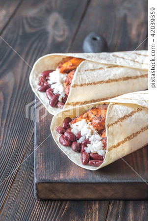 Chicken burritos on the wooden board 42039359