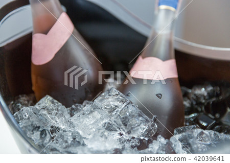 bottles of rose sparkling wine in ice bucket 42039641
