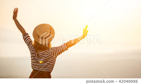 Happy woman jumping and enjoying life at sunset in mountains. Happy woman jumping and enjoying life at sunset in mountains. 42040098