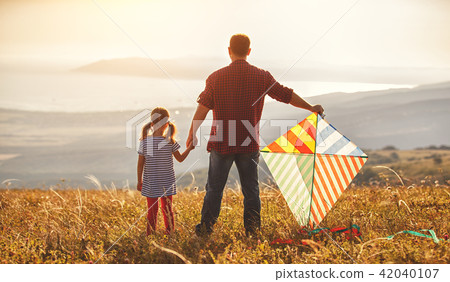 happy family father and child daughter launch kite on meadow happy family father and child daughter launch kite on meadow 42040107