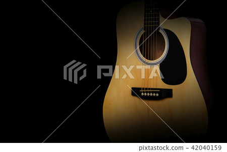 Part of acoustic guitar on old black background Part of acoustic guitar on old black background 42040159
