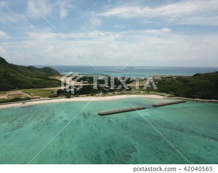Okinawa remote island aerial photograph Toganeki over the sky Drone Ocean Okinawa's color sky Fukugi row a tree 42040565