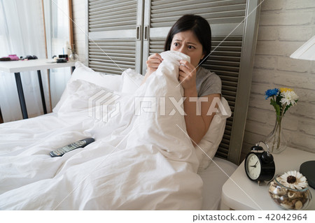woman lie in her bed and afraid see bloody scene woman lie in her bed and afraid see bloody scene 42042964