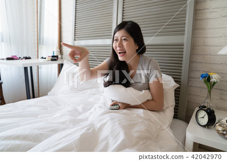 female pointing front while she saw funny scene 42042970