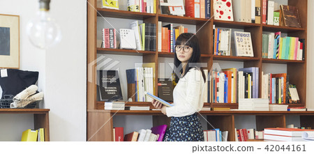A woman in a book store A woman in a book store 42044161