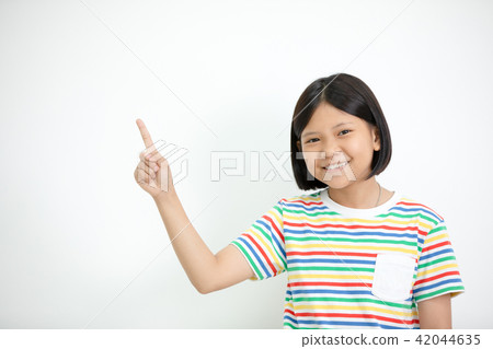 Asian girl smiling and pointing finger up . 42044635