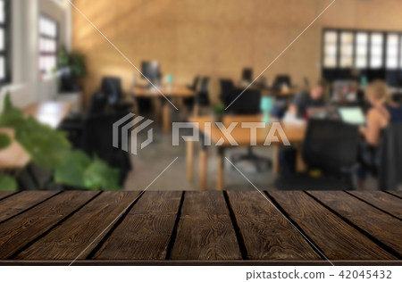 Selected focus empty brown wooden table in office with big windo Selected focus empty brown wooden table in office with big windo 42045432