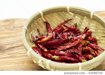 Red peppers served with bamboo 42046730