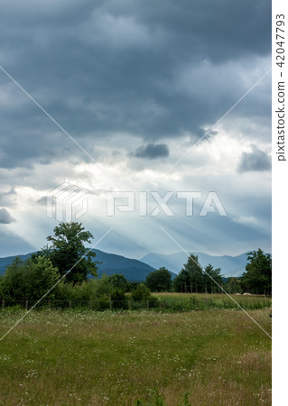 dramatic dark clouds landscape 42047793