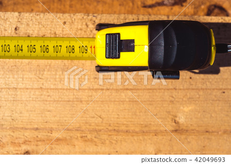 measuring tape on wood measuring tape on wood 42049693