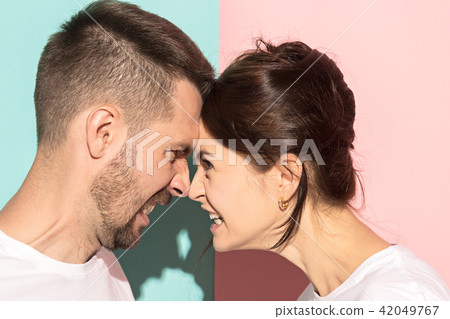 attractive angry couple fighting and shouting at each other attractive angry couple fighting and shouting at each other 42049767