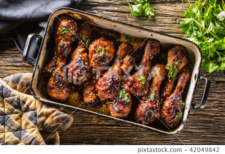 Grilled roasted and barbecue chicken legs in pan 42049842
