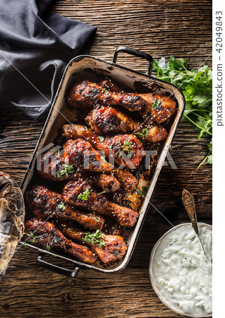 Grilled roasted and barbecue chicken legs in pan 42049843
