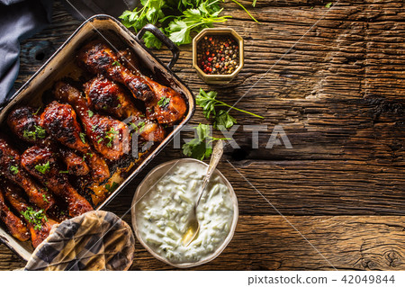Grilled roasted and barbecue chicken legs in pan 42049844