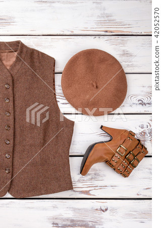 Sleeveless female woolen jacket, hat and heel boot. Sleeveless female woolen jacket, hat and heel boot. 42052570