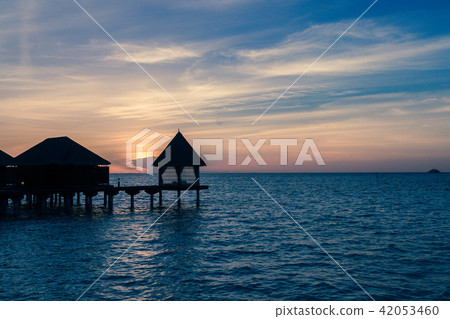 View of a resort with bungalows over Indian Ocean View of a resort with bungalows over Indian Ocean 42053460