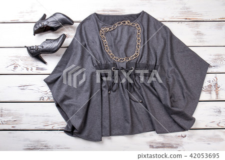Gray blouse and black high heel shoes, flat lay. Gray blouse and black high heel shoes, flat lay. 42053695