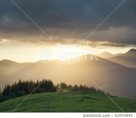 Mountain valley during sundown. Mountain valley during sundown. 42054945