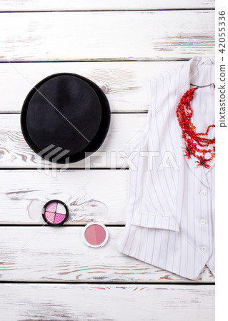 Flat lay black women hat and cosmetic powder. Flat lay black women hat and cosmetic powder. 42055336