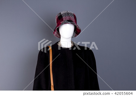 Portrait of white mannequin with dark female clothes. Portrait of white mannequin with dark female clothes. 42055604