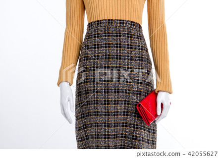 Woolen winter clothes and red purse. Woolen winter clothes and red purse. 42055627