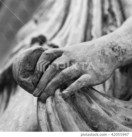 Stone statue detail of human hand 42055997