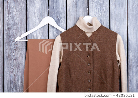 Warm winter women's wear on hangers. 42056151