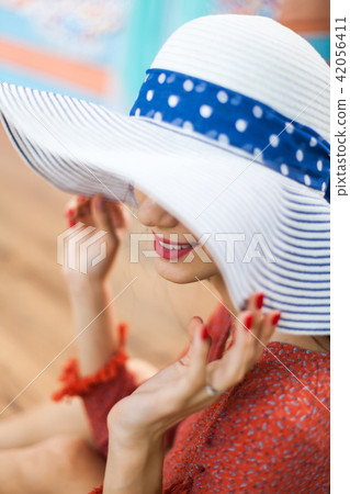 Portrait of attractive woman with hat 42056411