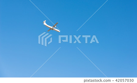 Passenger plane flying in the blue sky Passenger plane flying in the blue sky 42057030