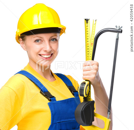 Young construction worker with hacksaw 42059458