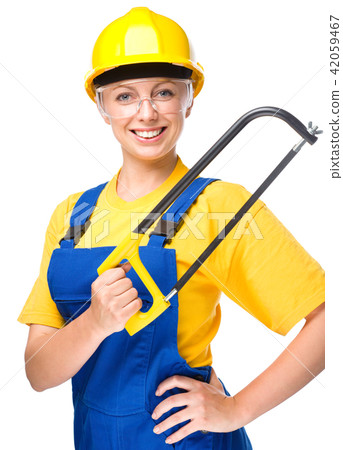 Young construction worker with hacksaw 42059467