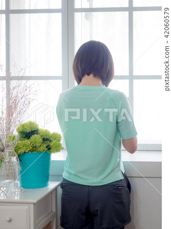 Back view of a Young girl with digital tablet in h Back view of a Young girl with digital tablet in h 42060579