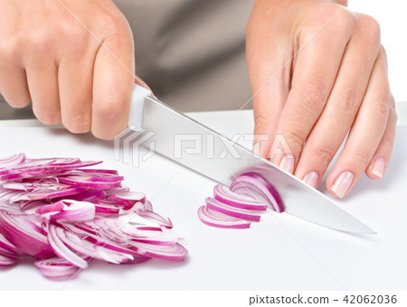 Cook is chopping onion Cook is chopping onion 42062036
