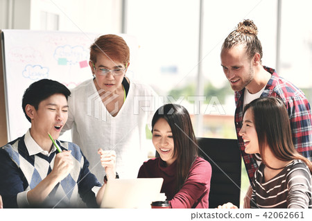 Group of businesspersons looking at successful Group of businesspersons looking at successful 42062661