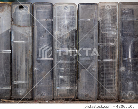 An old audiotapes in dirty plastic boxes, close up An old audiotapes in dirty plastic boxes, close up 42063103