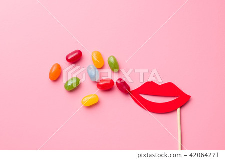 Sweet jelly beans and paper lips. 42064271