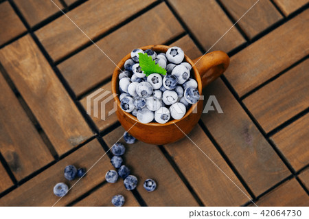 frozen blueberries in a clay cup frozen blueberries in a clay cup 42064730