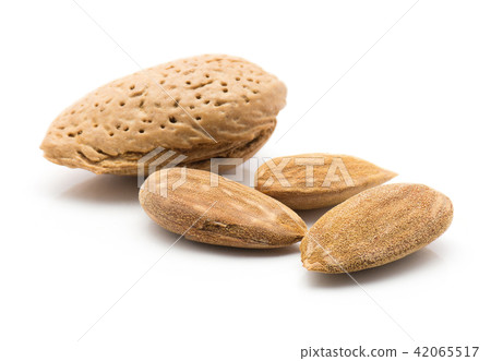 Raw almonds isolated on white Raw almonds isolated on white 42065517
