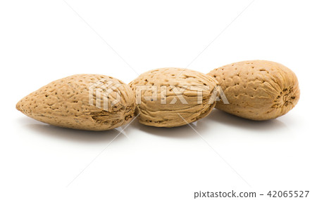 Raw almonds isolated on white Raw almonds isolated on white 42065527
