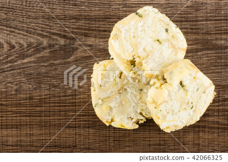 Fresh boiled Carlsbad bread dumpling on brown wood Fresh boiled Carlsbad bread dumpling on brown wood 42066325