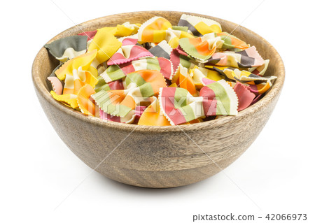 Colourful raw farfalle isolated on white Colourful raw farfalle isolated on white 42066973