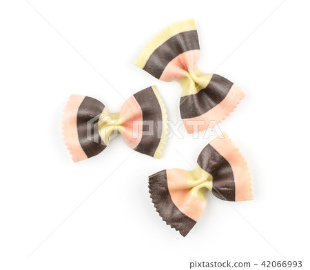 Colourful raw farfalle isolated on white Colourful raw farfalle isolated on white 42066993