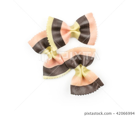 Colourful raw farfalle isolated on white Colourful raw farfalle isolated on white 42066994