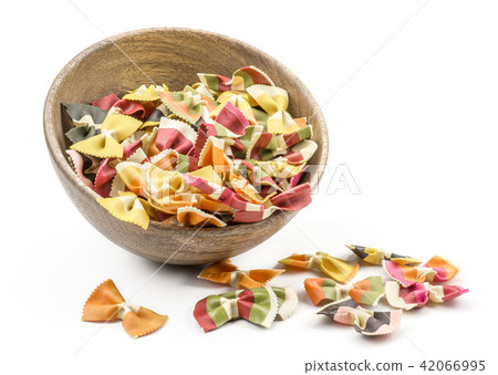 Colourful raw farfalle isolated on white Colourful raw farfalle isolated on white 42066995