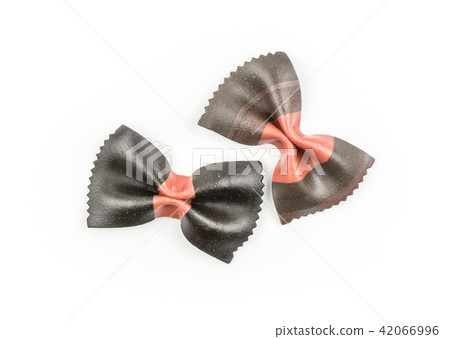 Colourful raw farfalle isolated on white Colourful raw farfalle isolated on white 42066996