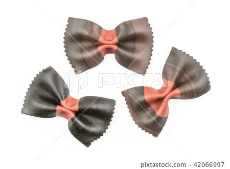 Colourful raw farfalle isolated on white Colourful raw farfalle isolated on white 42066997