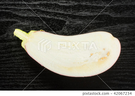 Fresh raw striped Eggplant on black wood 42067234