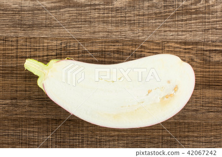 Fresh raw striped Eggplant on brown wood 42067242